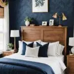 bedroom with a cozy bed , wood nightstands and headboard and navy blue wallpaper