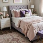 A feminine neutral bedroom that has a bed , night stands and a pink and purple color palette