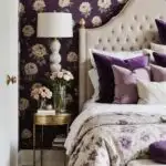 A neutral romantic bedroom with purple floral wallpaper