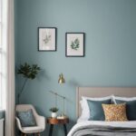 bedroom with blue walls, window, bed and two frames on the wall