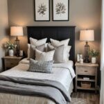 bedroom with taupe walls , bed, night stands and lamps