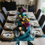 dining room with rectangular table with place setting and flowers as a centerpiece