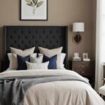 bedroom with taupe walls, bed and large headboard