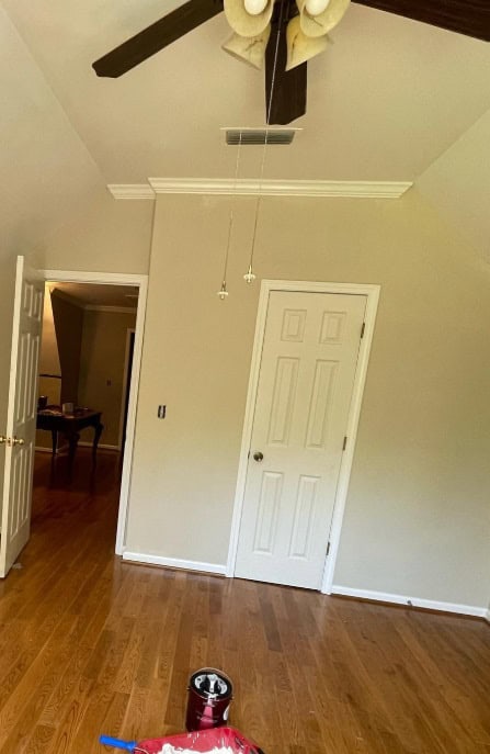  an empty room with hardwood floors 