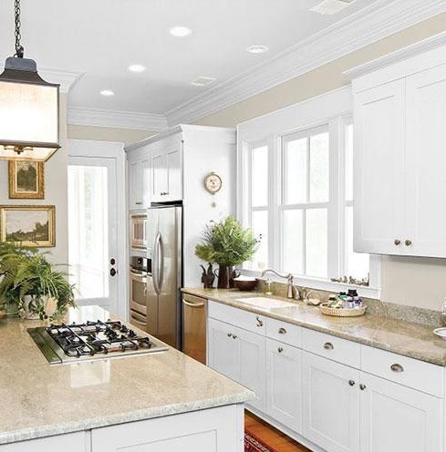 Kitchen with white cabinets,  and kitchen island