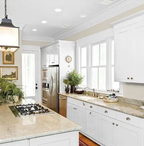 Kitchen with white cabinets,  and kitchen island