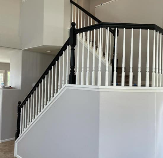 stairway with black railing and Alpaca painted walls