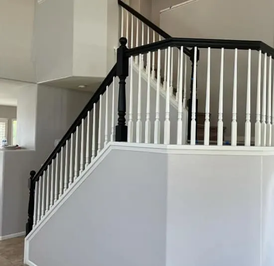 stairway with black railing and Alpaca painted walls