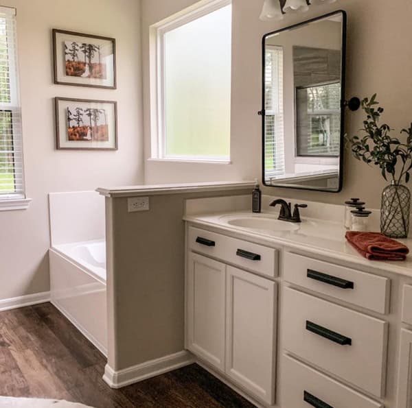 bathroom with tub, and vanity