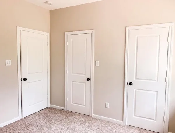 bedroom with three doors