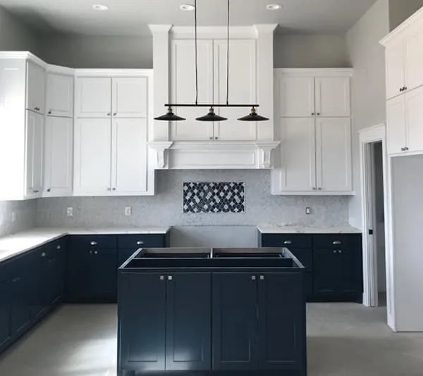 Cavalry paiinted on lower kitchen cabinets with whit upper cabinets
