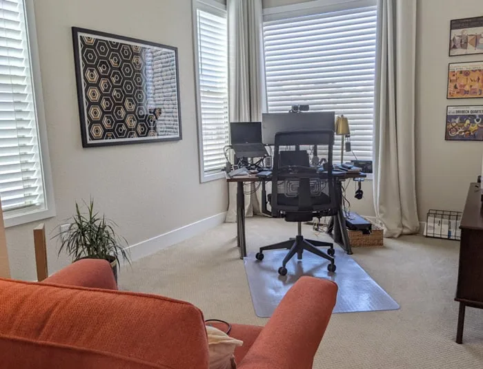 home office with desk and orange chair